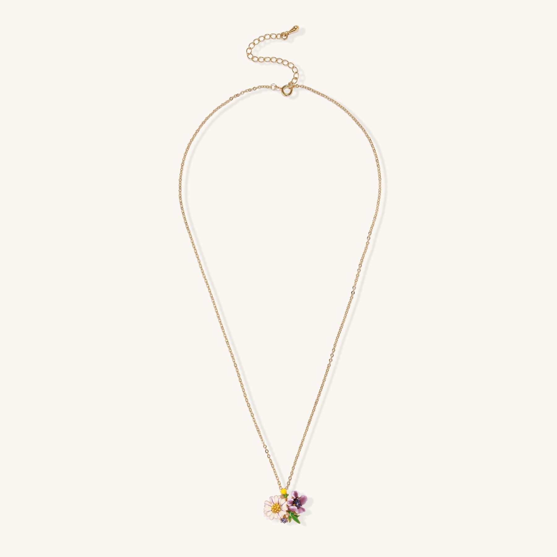 Delicate 18K gold plated necklace featuring colorful enamel flowers in pink and white with green leaves on chain