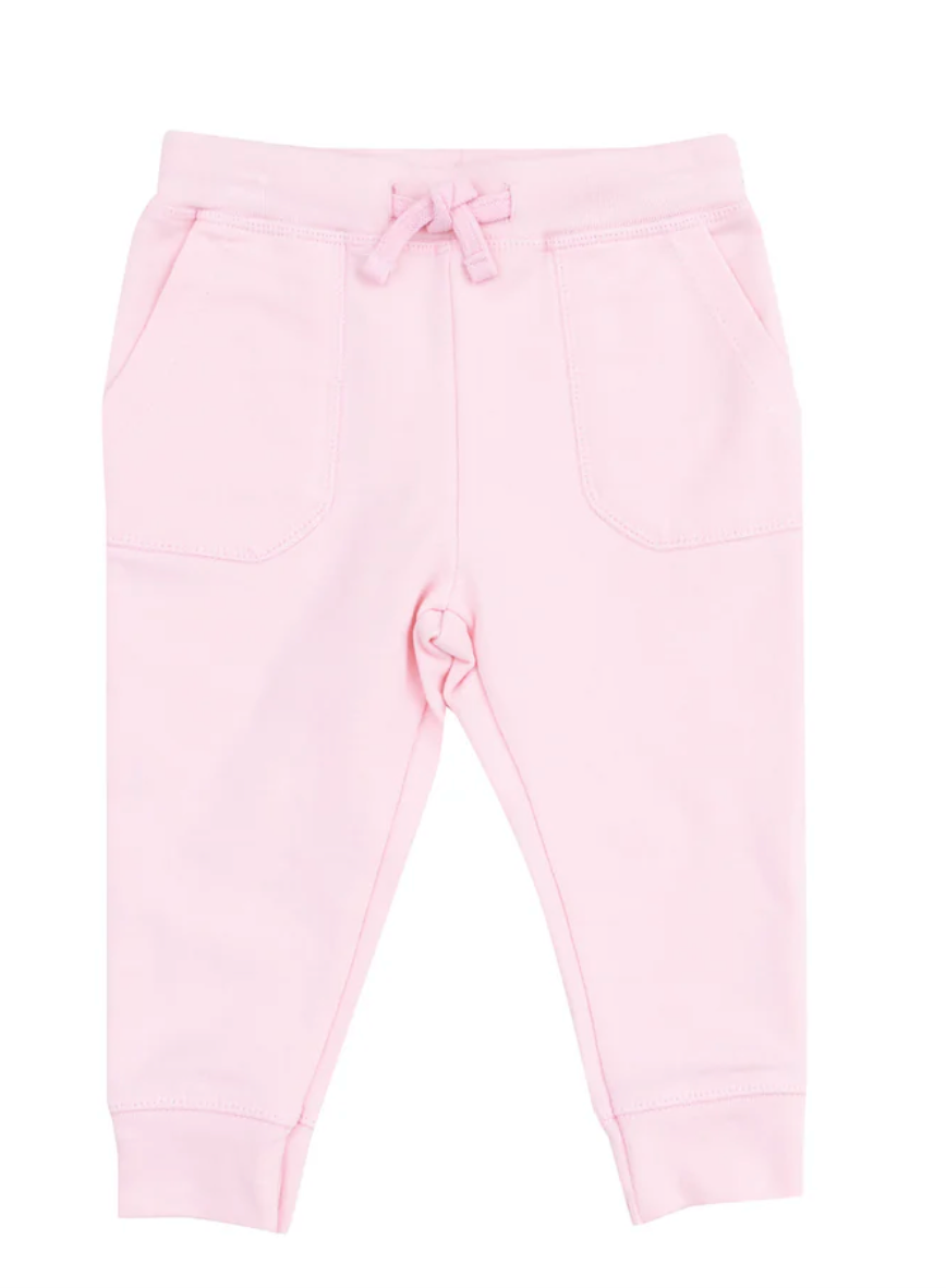A pair of pink French terry jogger pants for babies, with a soft elastic waistband and made from a blend of organic cotton and spandex.
