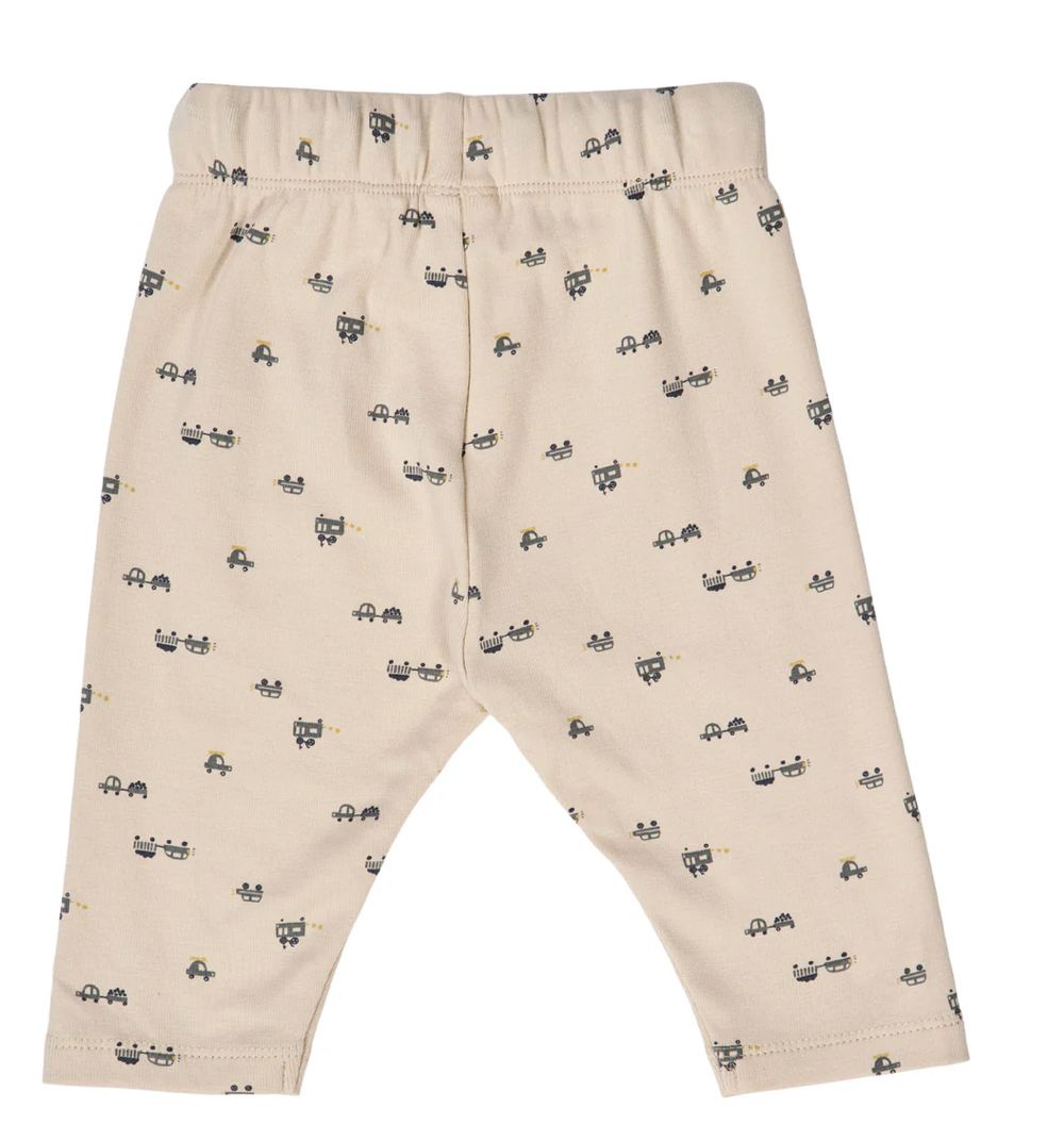 Backside view of Green Cotton Group beige baby pants with small black auto patterns on a white background
