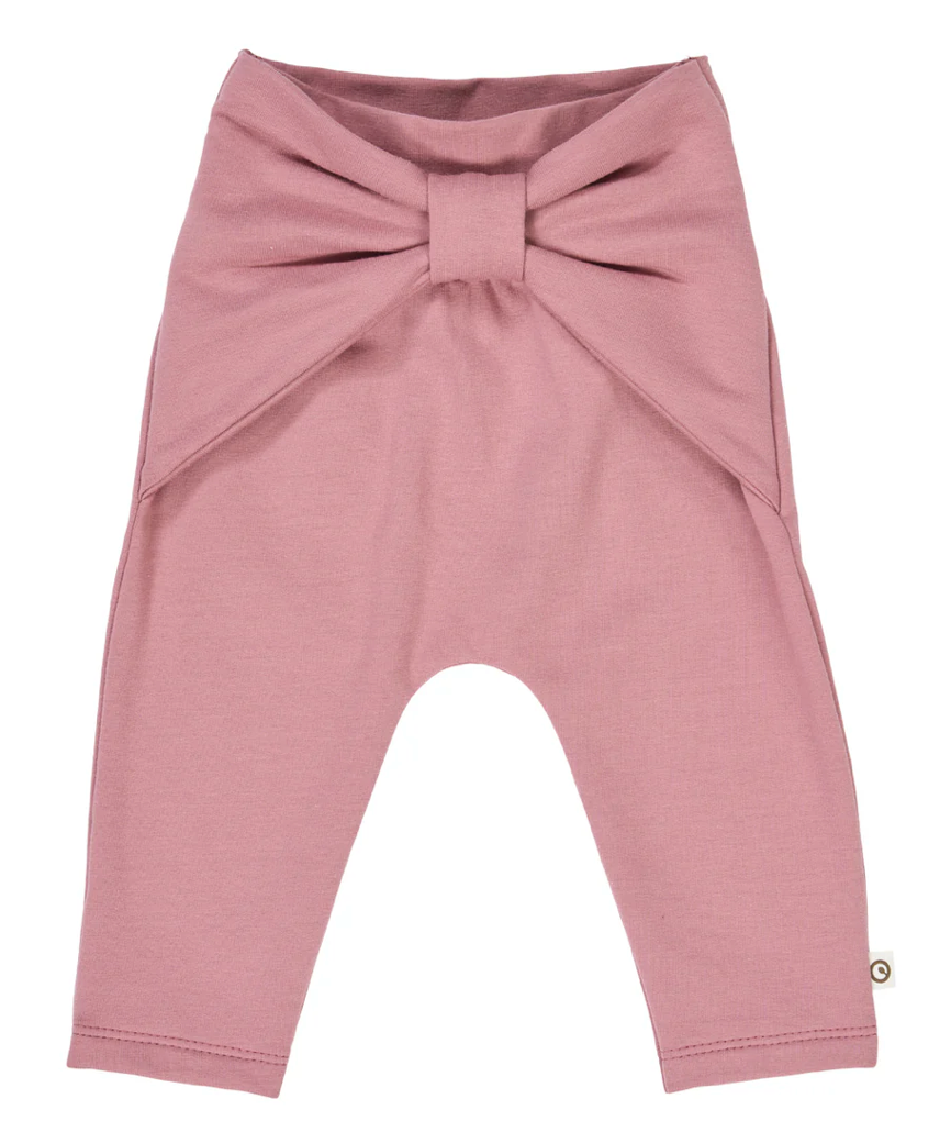 Green Cotton Group pink baby leggings with a bow on a white background