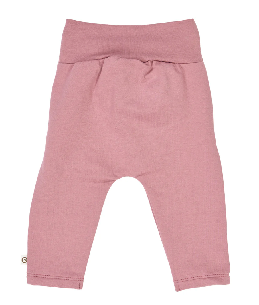 Back side view of Green Cotton Group pink baby pants on a white background