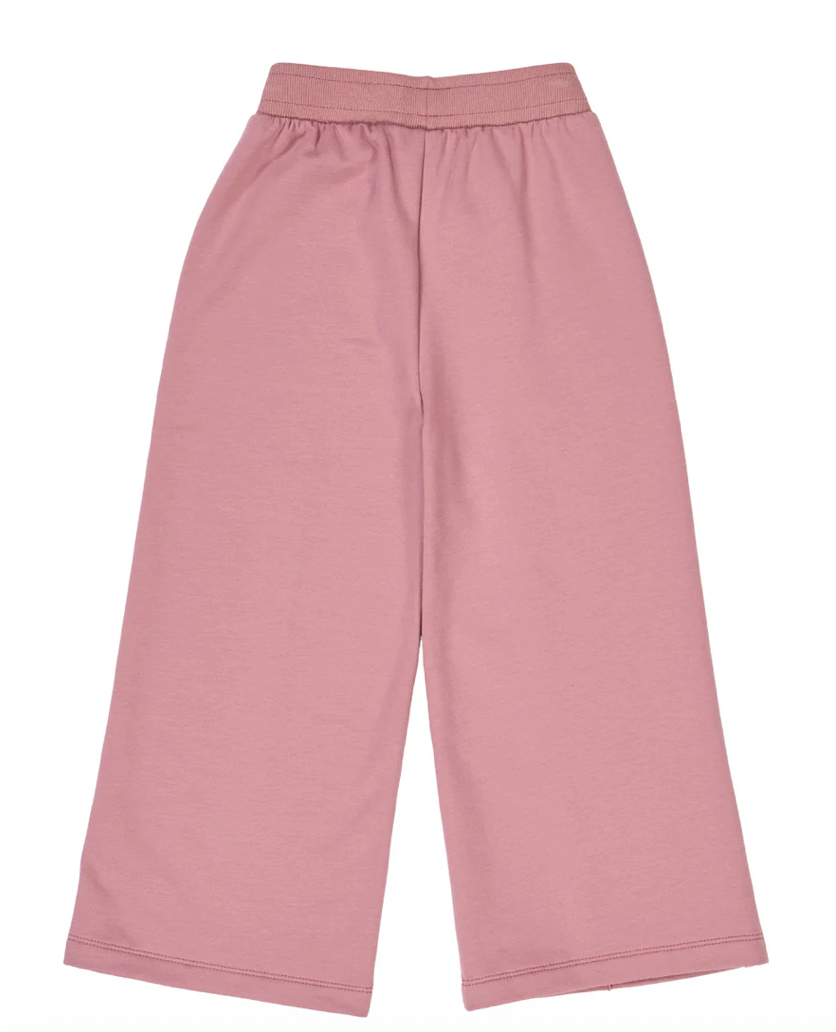 Back side view of Green Cotton Group pink pants on a white background