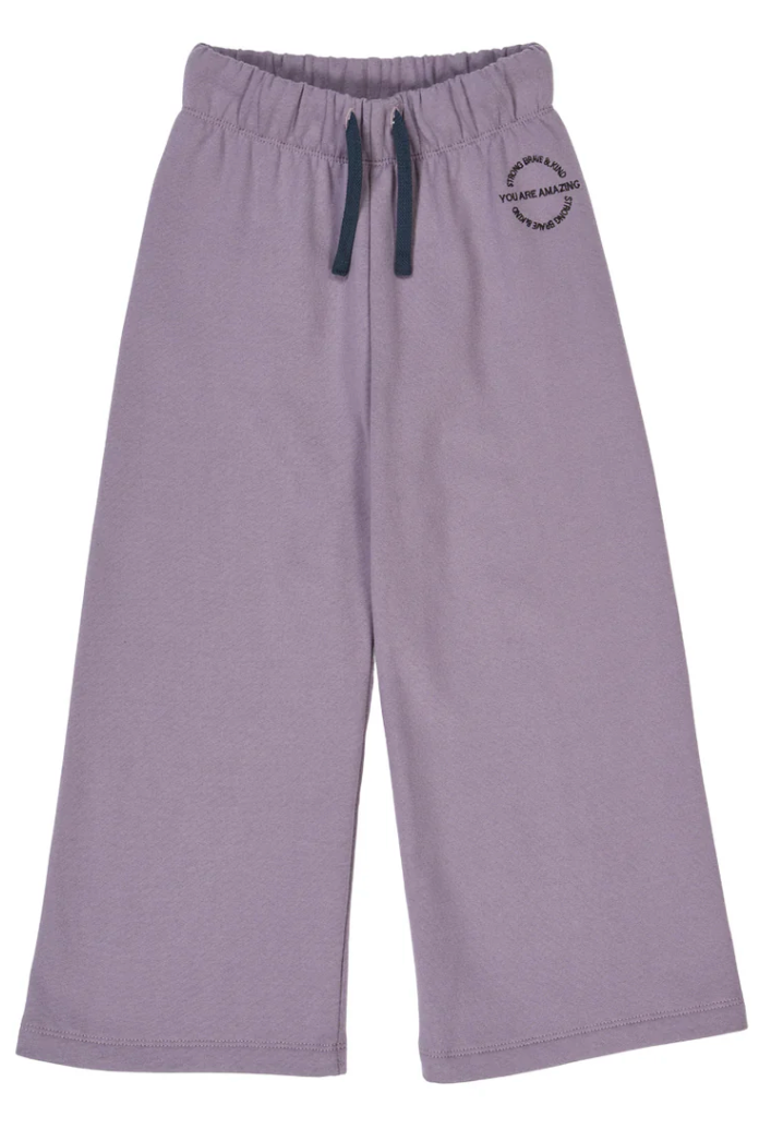 Green Cotton Group lilac sweatpants with a logo on a white background