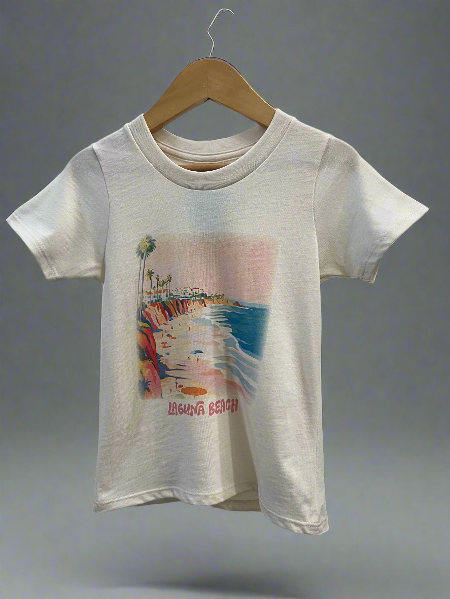 A white t-shirt with a watercolor print design featuring beach elements and the text 'Beach Life'.