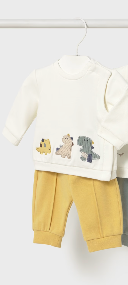 Mayoral Baby dino set children's outfit with a white sweater and yellow pants on a hanger against a white background