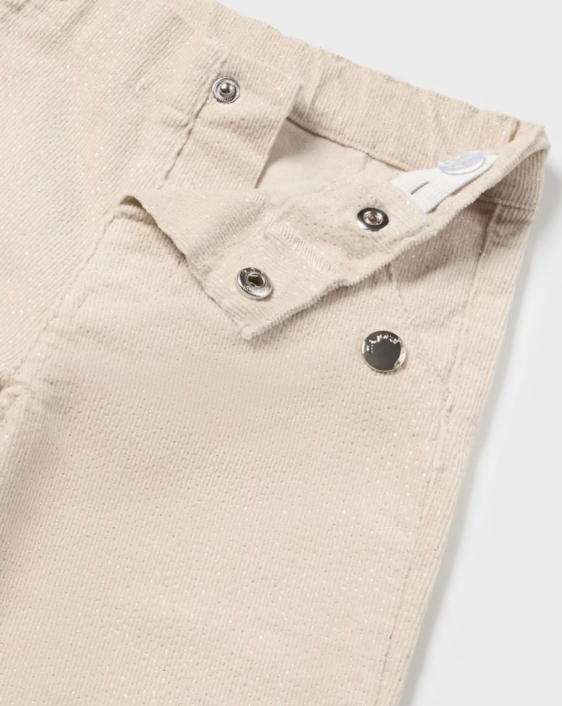 Close-up view of Mayoral beige sparkle pants