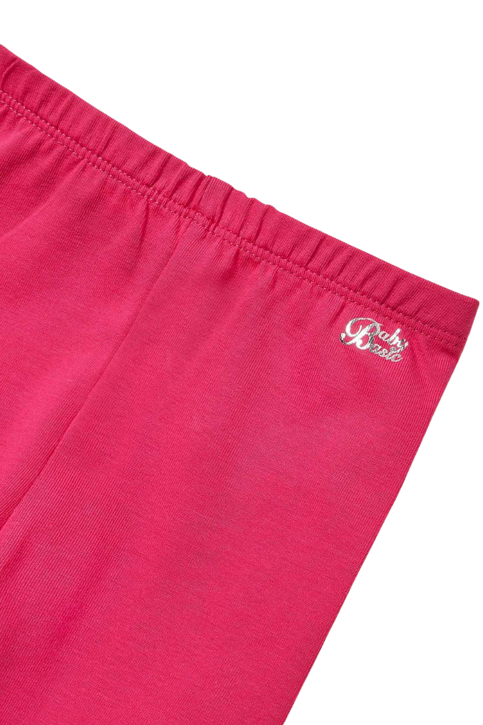 Close up view of pink leggings with logo
