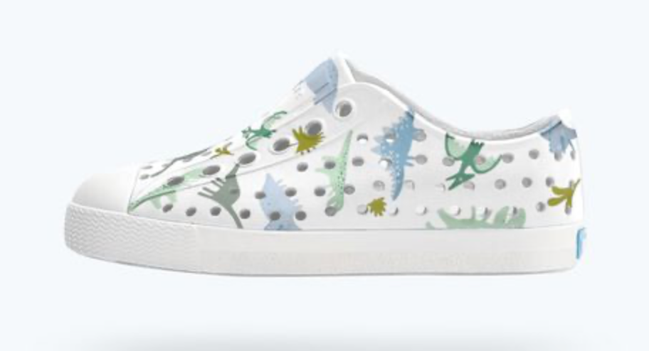 White sneaker with colorful plant pattern on a white background