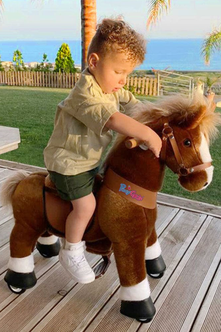 kid riding play horse