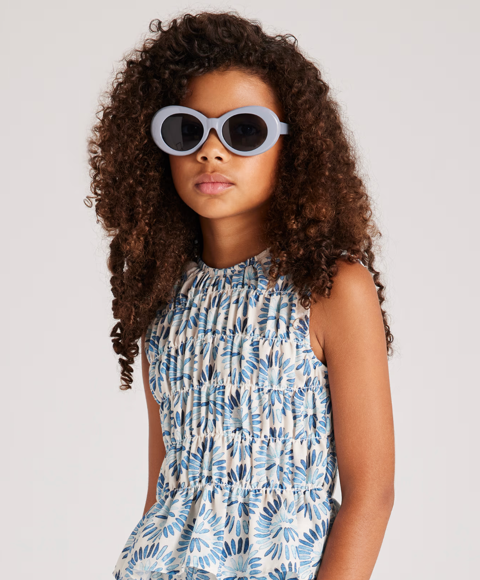 Smocked blue and white sleeveless blouse