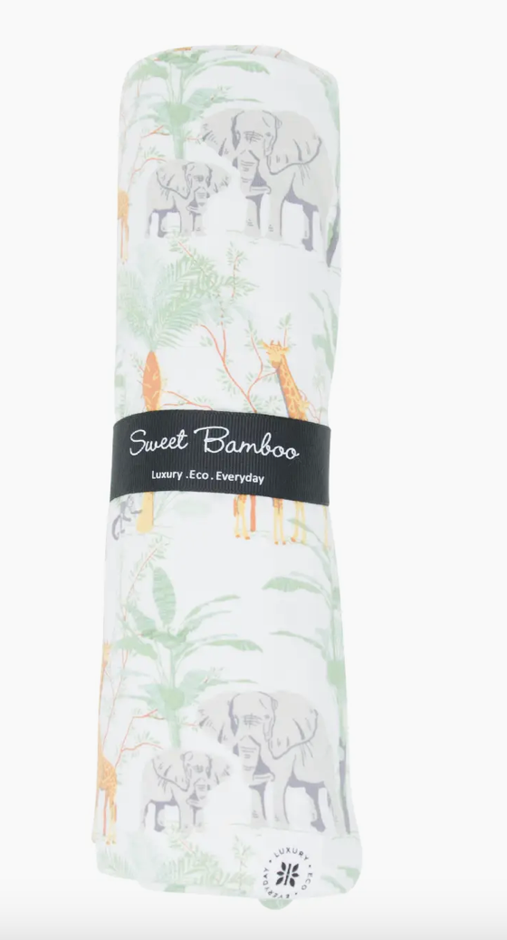 Sweet Bamboo swaddling blanket with a jungle theme, featuring illustrations of elephants and palm trees, rolled up with a label that says 'Sweet Bamboo'.