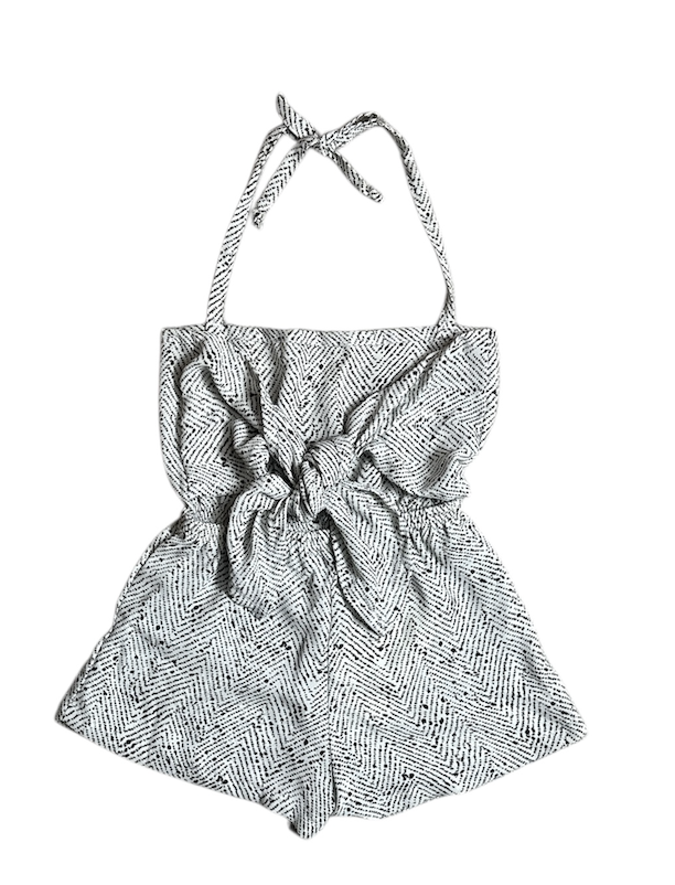 Black and white patterned halter top with a bow detail