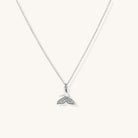 Delicate 14K gold-plated whale tail pendant necklace with sparkling crystal details on fine chain against white background.