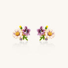 Delicate gold-plated stud earrings featuring white daisy and purple flowers with green leaves and crystal accents