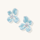 Turquoise blue enamel flower earrings with crystal centers and gold-plated brass posts on white background.
