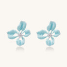 Turquoise blue enamel flower earrings with crystal centers and gold-plated brass posts on white background.