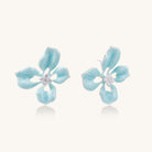 Turquoise blue enamel flower earrings with crystal centers and gold-plated brass posts on white background.