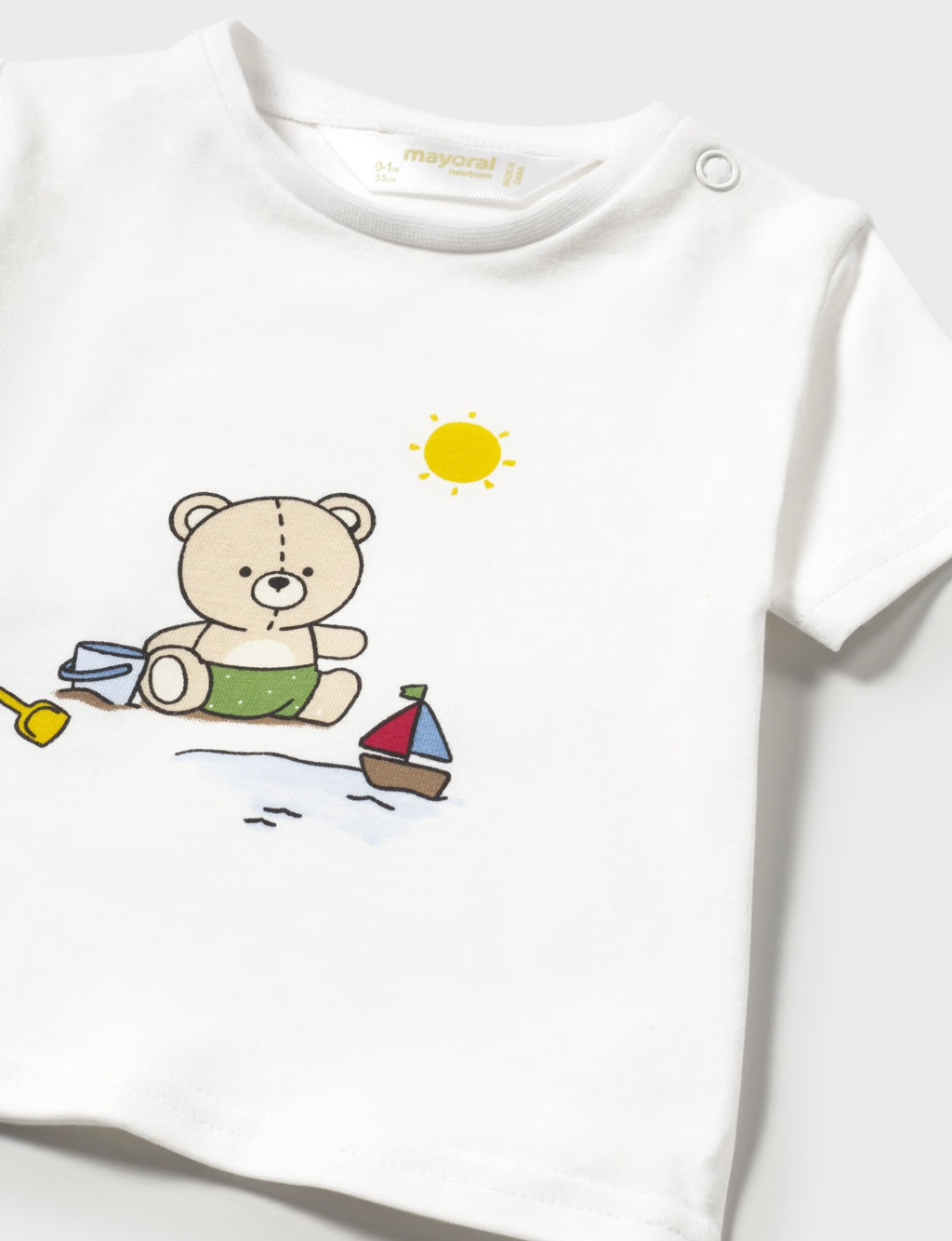 Close up of the shirt in the 3-piece baby swim set with bear on it.