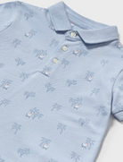 Close up of blue palm tree polo for boys