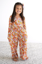 Little girl wearing floral bamboo romper