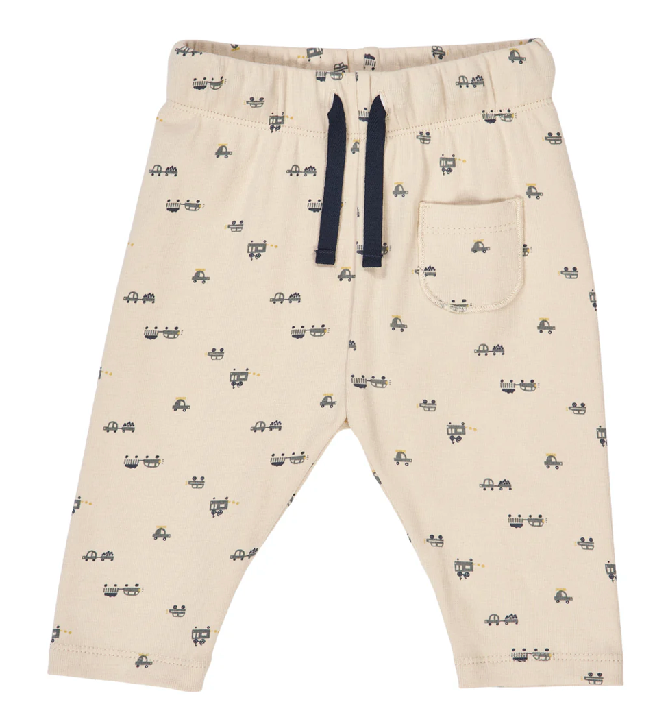 Green Cotton Group beige pants with black car pattern on a white background