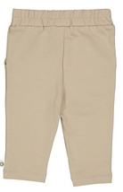 Backside view of Green Cotton Group Beige chino pants on a white background