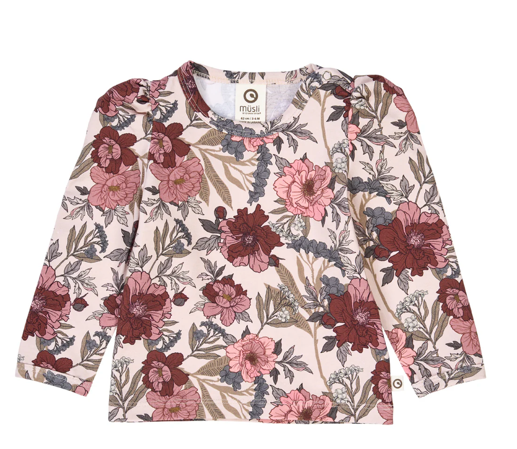 Green Cotton Group floral patterned shirt with puffed shoulders on a white background