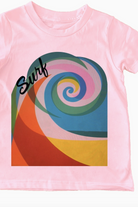 A pink t-shirt with a colorful geometric wave pattern and the word 'Surf' printed on the front.