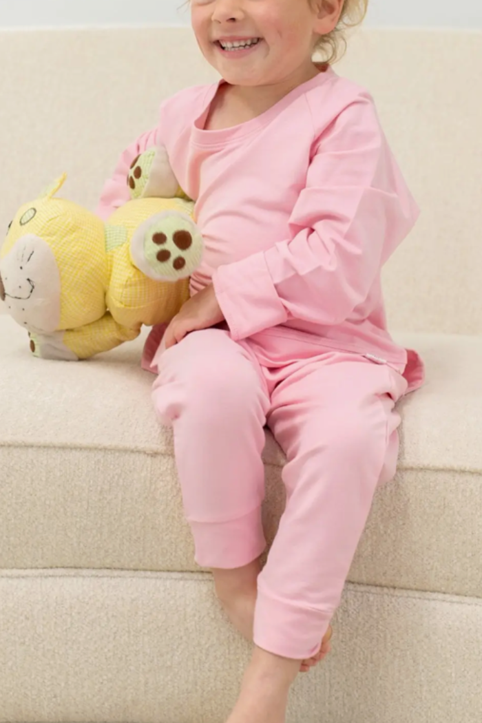 Little girl wearing Sweetbamboo pink top and pants set