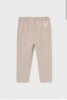 A pair of Mayoral baby girl leggings in beige.