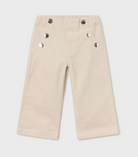 A pair of Mayoral beige sparkle pant with buttons on the front and adjustable waistband
