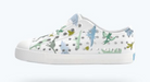 White sneaker with colorful plant pattern on a white background