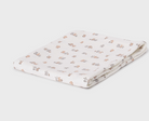 Folded white animal print swaddle blanket